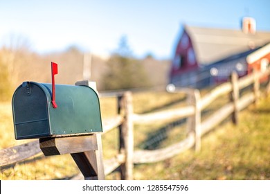 Mail Box With Raised Mailbox Flag Outside. American Mailbox. Rural View, Blurred Background