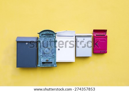 Mail boxes on a yellow wall