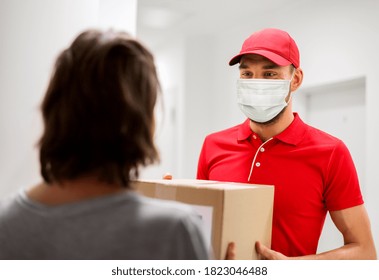 Mail Delivery, Shipment And Pandemic Concept - Man Wearing Face Protective Medical Mask For Protection From Virus Disease Delivering Parcel Box To Customer Home