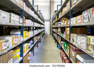 Mail Office, Lot Of Package Are In Post Warehouse. Parcels On Racks At Office Room. Perspective View Of Shelvings In Storage Indoor. Moscow - March 18, 2016