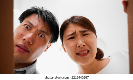 Mail Order Image Of A Woman And A Man Opening A Cardboard Box