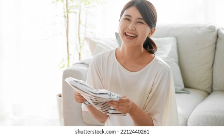 Mail Order Image Of A Woman Opening A Cardboard Box