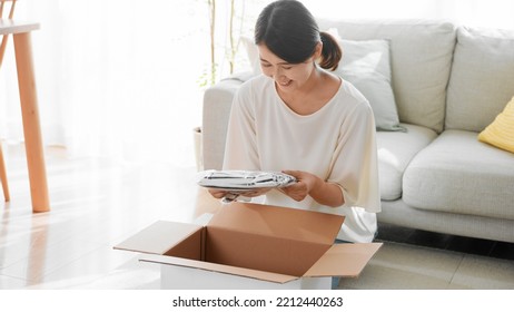 Mail Order Image Of A Woman Opening A Cardboard Box