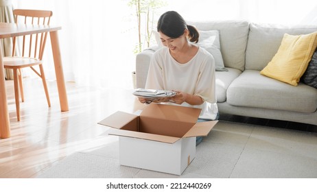 Mail Order Image Of A Woman Opening A Cardboard Box