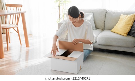 Mail Order Image Of A Woman Opening A Cardboard Box