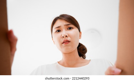 Mail Order Image Of A Woman Opening A Cardboard Box