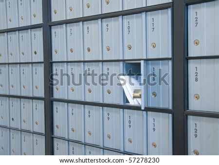 mail waiting in the u.s. grey/blue post office box