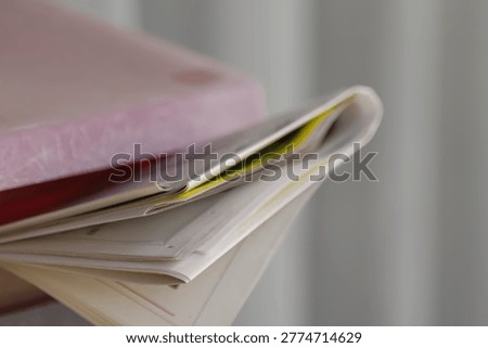 A mailbox with a newspaper inserted