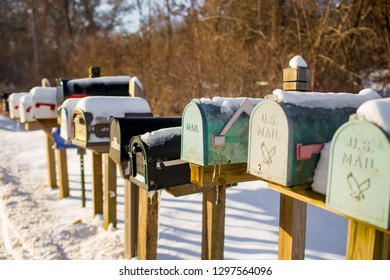 mailboxes in a row with snow and ice 