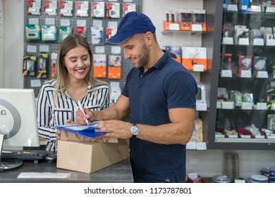 Mailmain delivering items to the girl inside the shop