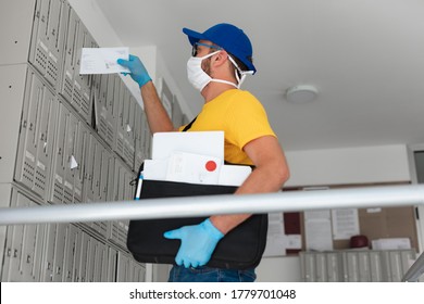 Mailman Delivering Mail With Mail-bag And Protective Mask And Gloves During Virus Pandemic.