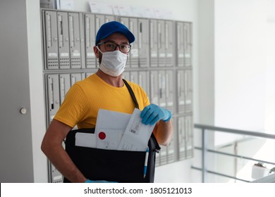 Mailman Delivering Mail With Mail-bag And Protective Mask And Gloves During Virus Pandemic.