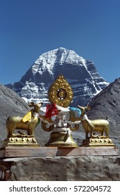 The main Buddhist symbol Dharmachakra on the roof of Buddhist monastery Driraphuk gompa at the North Face of sacred Mount Kailash in Western Tibet.