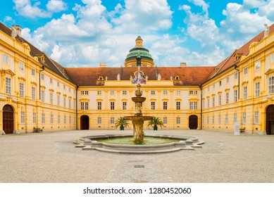 The main courtyard of historic Melk Abbey and blue sky in summer, Austria