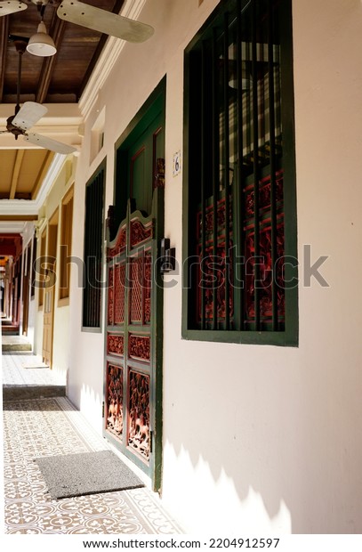 Main doors of houses along side\
Emerald Hill in Singapore street                             \
