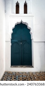 Main entrance of a mosque in Morocco. Traditional green door