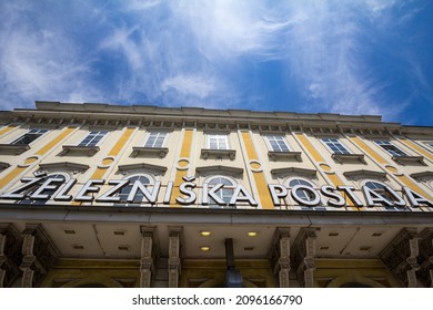 Main facade of the train station of Ljubljana, with railway station written in Slovenian (Zelezniska Postaja). It is the main hub of transportation in Slovenia and the hq of Slovenian Railways. - Shutterstock ID 2096166790