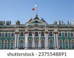 The main facade of the Winter Palace with the Russian flag on the spire. Saint Petersburg