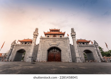 Main gate of Hung King Temple, Phu Tho Province, Vietnam. Text on gate in English meaning Hung King temple. Travel and landscape concept.