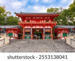 Main gate of Yasaka shrine in Gion district, Kyoto, Japan (translation "Monthly Ceremony Festival 10:00 AM")