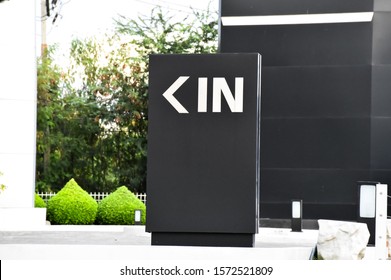 Main Office Entrance  Modern Style With Symbols (in). White Letter Sign On Black Background.