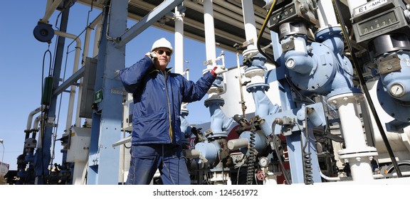 Main Oil And Fuel Station Inside Large Oil And Gas Refinery, Worker Talking In Phone