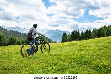 Main On Mountain With His Bike In Alps