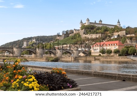 Main river with a view of the medieval bridge, Alte mainbrücke and fortress Marienberg in the historic city of Würzburg.