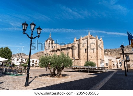 Main square of a town in Spain on a sunny summer day. Church of Moral de Calatrava