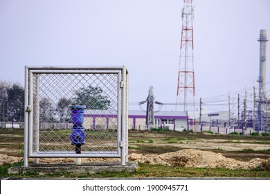 Main Water Valve With Industrail Factory Background, Water Meter On Concrete, Measuring Device, Water Pipe And Meter With Waterspout Of Home