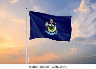 Maine flag waving sundown sky