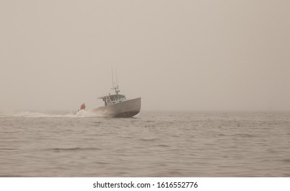 Maine Lobster Boat Emerging From Fog Bank