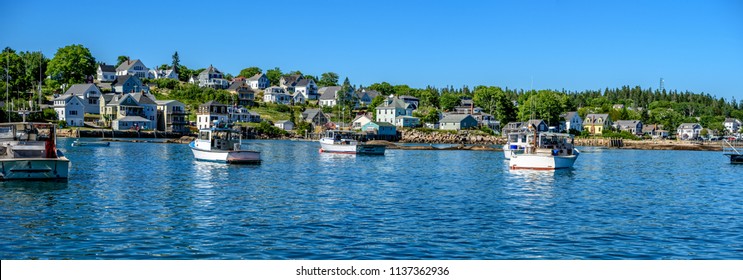 Maine Lobster Boats Anchored in a Bay in Front of a Quaint New England Village