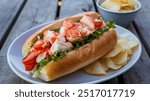 Maine Lobster Roll: Sweet, tender chunks of Maine lobster, lightly dressed with mayo, served in a buttery toasted roll with a sprinkle of chives for a New England classic.






