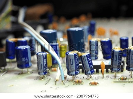 Mainly capacitors on printed circuit board. Componenets in industrial electronic concept.
