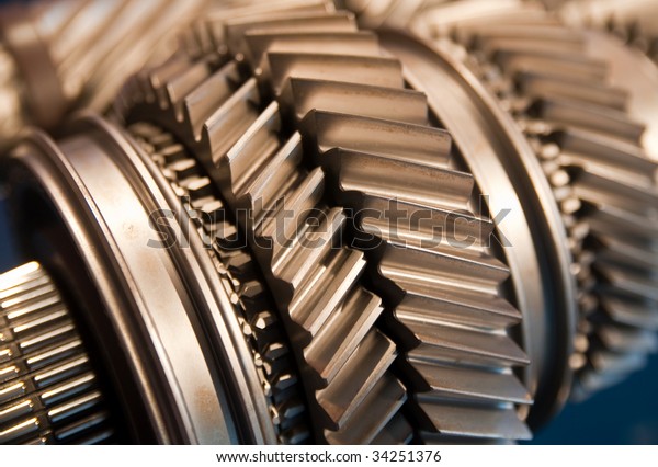 A Mainshaft and Countershaft of a\
transmission with gears meshing. Focus on the\
gears.