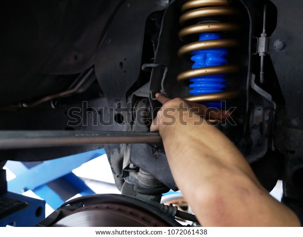 maintaining a car shock
absorbers at
garage.
