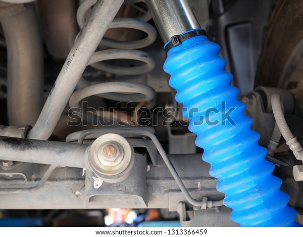 maintaining a car shock\
absorbers at garage.\
