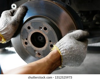 maintaining car wheel brake disc at repair service station. - Shutterstock ID 1312525973