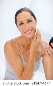 Maintaining Good Beauty Habits. Shot Of An Attractive Mature Woman Taking Care Of Her Skin.