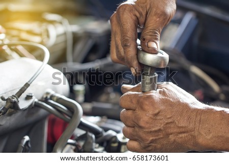 maintenance car using screwdriver. dirty man hands holding tools fixing repair car engine.
Close up mechanical man dirty hands holding tools using screwdriver maintenance car vehicle service.