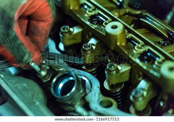 Maintenance\
check and adjust valve lash in car\
engine