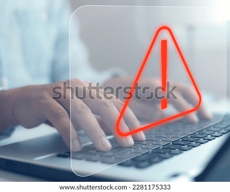 maintenance concept Hacker Attacks and Hacking cybercrime cyber security The user is using the computer with a warning triangle for error notification.