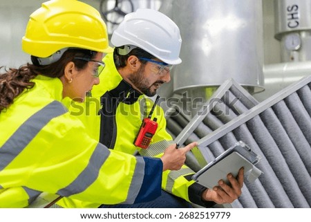Maintenance engineer checking filtration systems for optimal operation in water and steam industries.