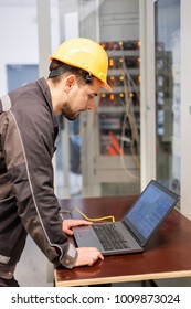Maintenance engineer inspect relay protection system with laptop computer. Bay control unit. Medium voltage switchgear - Shutterstock ID 1009873024