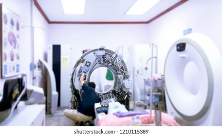 Maintenance Engineer Repairing And Checking CT Scanner Machine Every 3 Month In The Hospital. Services Concept.