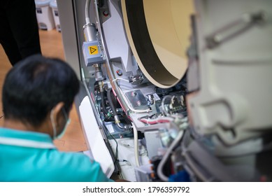 Maintenance Engineer Repairing And Checking CT Scanner Machine In The Hospital. Services Concept.Thailand