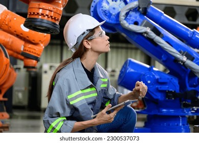 Maintenance engineer worker working with robotic machine automation