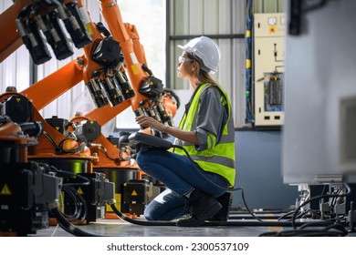 Maintenance engineer worker working with robotic machine automation