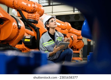 Maintenance engineer worker working with robotic machine automation